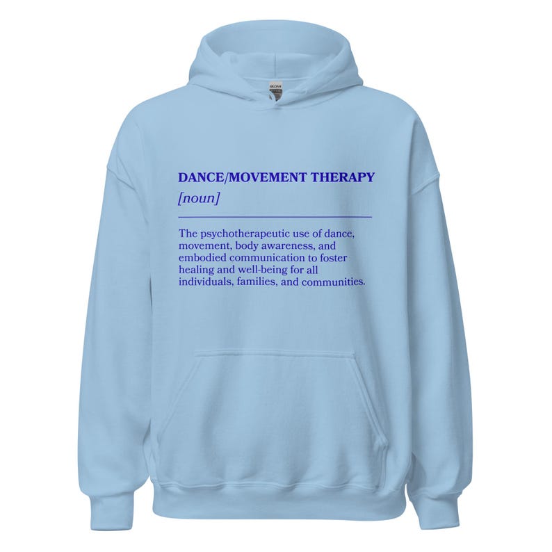 May include: A light blue hoodie with the text "DANCE/MOVEMENT THERAPY [noun]" in blue. The text below describes the psychotherapeutic use of dance, movement, body awareness, and embodied communication to foster healing and well-being.