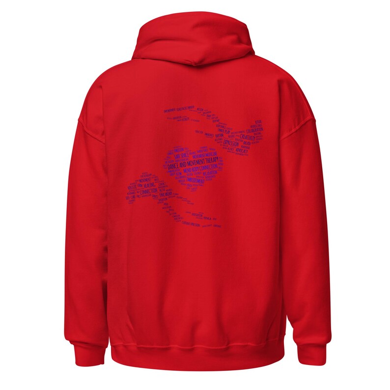 May include: A red hooded sweatshirt with a blue graphic on the back. The graphic features the words "Dance and Movement Therapy" in a heart shape, surrounded by other words. The sweatshirt has a drawstring hood and a kangaroo pocket.