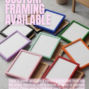 May include: A collection of rectangular picture frames in various solid colors including blue, green, orange, red, pink, lavender, mint, and black. Each frame features a white mat board insert and a brown backing. Text reads CUSTOM FRAMING AVAILABLE.