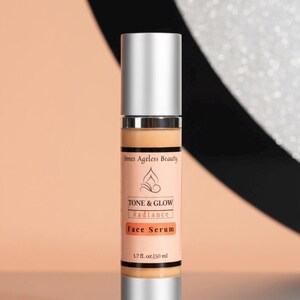 May include: A silver and beige face serum bottle with the text "Innes Ageless Beauty" and "TONE & GLOW Radiance Face Serum". The bottle contains 1.7 fl. oz. [50 ml] of product.