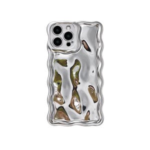 May include: A silver phone case with a wavy, textured design. The case has a reflective, metallic finish and a rectangular shape with rounded corners. The camera cutouts are visible at the top.