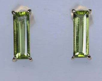 Peridot and yellow gold stud earrings.
