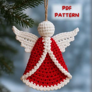 May include: A handmade crochet angel ornament with a red body and white wings and trim. The angel is suspended by a natural twine string. The text "PDF PATTERN" is in a white box with red text.