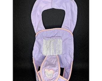 Accesorio portabebés My Little Pony So Soft Baby Alive con forma de pétalo de paloma, color morado.