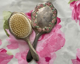 Vintage silver plated, hand mirror, and brush with pink rosettes