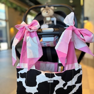 May include: A set of three ceramic nesting bowls in shades of blue, green, and white. The bowls feature a speckled glaze and a simple, modern design. The largest bowl measures approximately 6 inches in diameter.