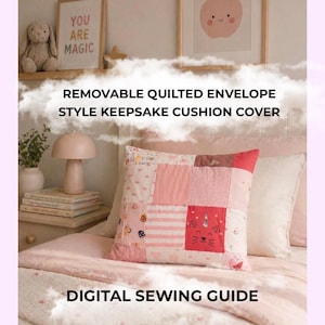 May include: A square quilted cushion cover featuring a patchwork design in various shades of pink and white. The fabric squares include patterns of stripes, hearts, and a central graphic of a cat with a unicorn horn. Text reads REMOVABLE QUILTED ENVELOPE STYLE KEEPSAKE CUSHION COVER and DIGITAL SEWING GUIDE.