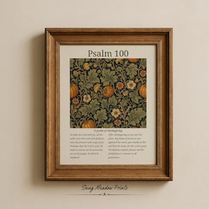 May include: A framed wall art print featuring Psalm 100 with a central square pattern of orange pumpkins and green foliage on a dark background. The text includes the title Psalm 100, the subtitle A psalm of thanksgiving, and the full scripture text.
