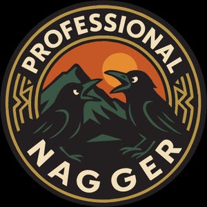 May include: Circular black graphic with the words "PROFESSIONAL NAGGER" in a cream-colored font. The design features two black ravens with open beaks, a mountain range, and a setting sun in shades of orange and green.