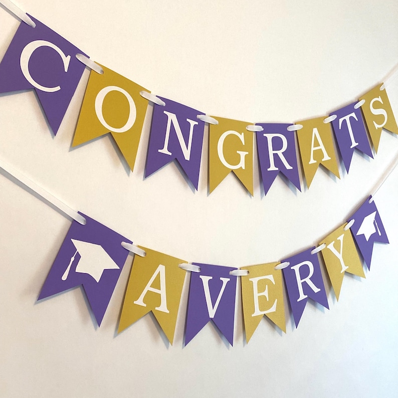 May include: Purple and gold graduation banner with the text "Congrats Avery" and a graduation cap graphic.