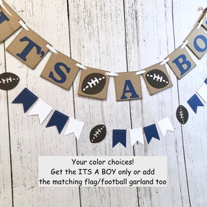 May include: It's a Boy banner with brown and blue paper pennants, white string, and football decorations. The banner reads "It's a Boy".