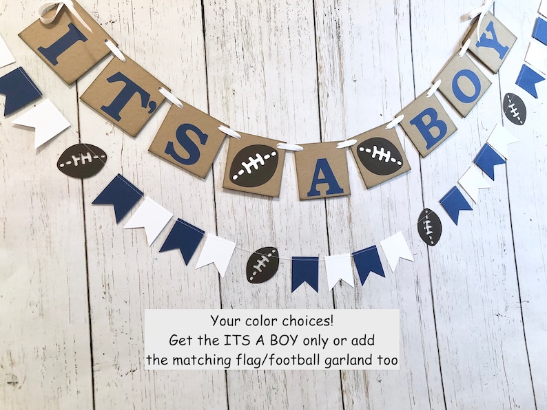 May include: It's a Boy banner with brown and blue paper pennants, white string, and football decorations. The banner reads "It's a Boy".