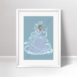 May include: A framed art print featuring a stylised illustration of a figure in a light blue gown, surrounded by swirling white magical sparkles and light trails against a solid light blue background, presented in a simple white frame.