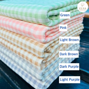 May include: A stack of folded cotton fabric in various colors, including green, pink, light brown, dark brown, dark purple, and light purple. Each fabric has a checkered pattern. The image also includes the text "Green", "Pink", "Light Brown", "Dark Brown", "Dark Purple", and "Light Purple".