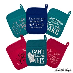 May include: A collection of colorful oven mitts with various baking-themed phrases and graphics. The mitts are teal, red, and navy blue. Text includes "Life is what you bake of it!", "I just want to bake stuff & open presents!", and "Can't touch this."