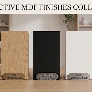 May include: A collection of five rectangular MDF finish samples labeled DISTINCTIVE MDF FINISHES COLLECTION. The samples include walnut, oak, black, white, and anthracite, each with a small metal plaque describing the finish and texture.