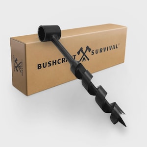 May include: A black auger drill bit with a cylindrical handle and a spiral drill. The drill bit is positioned in front of a brown cardboard box with the text "BUSHCRAFT SURVIVAL" printed on it.