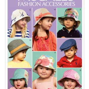 May include: A McCall's Fashion Accessories pattern featuring various children's hats. The hats include a striped sun hat, a beige hat with a coral bow, a plaid bucket hat, a gray hat with an orange band, a blue newsboy cap, a floral hat, a pink polka dot hat, and a two-tone hat.