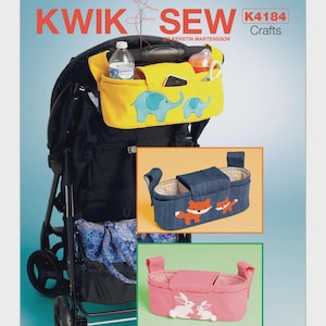 May include: A Kwik Sew K4184 Crafts sewing pattern envelope featuring three stroller organizers. One is yellow with blue elephant appliqués, one is blue denim with fox appliqués, and one is pink with white rabbit appliqués, all shown on a stroller.