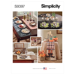May include: Simplicity S9397 sewing pattern envelope featuring various home decor items including table runners, placemats, fabric pumpkins, and decorative baskets. The images display finished textile projects with autumn-themed patterns and designs.