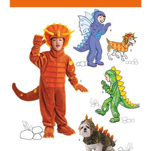 May include: Simplicity pattern 1765 features children's and pet costumes. The image shows a child in an orange dinosaur costume, a child in a purple fairy costume, a dog in a spotted costume, a child in a green dinosaur costume, and a dog in a dinosaur costume.