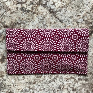Organizador/porta cupones/cartera con forma de estrella explosiva color burdeos