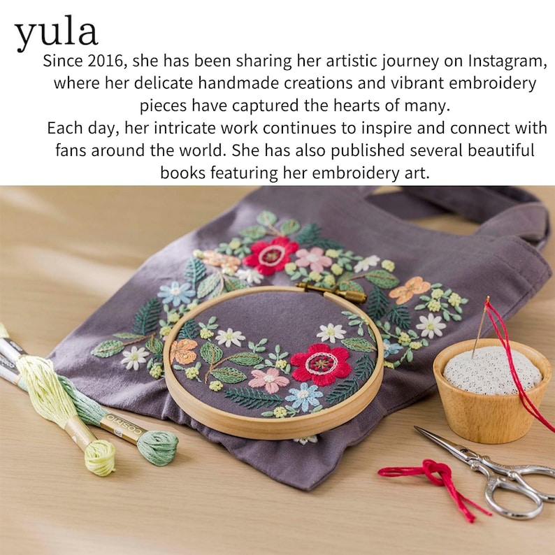May include: An embroidery hoop with a floral design, featuring red, pink, and blue flowers, rests on a gray fabric tote bag. The image includes embroidery floss, a pincushion, and scissors. The text "yula" and a description of the artist are visible.