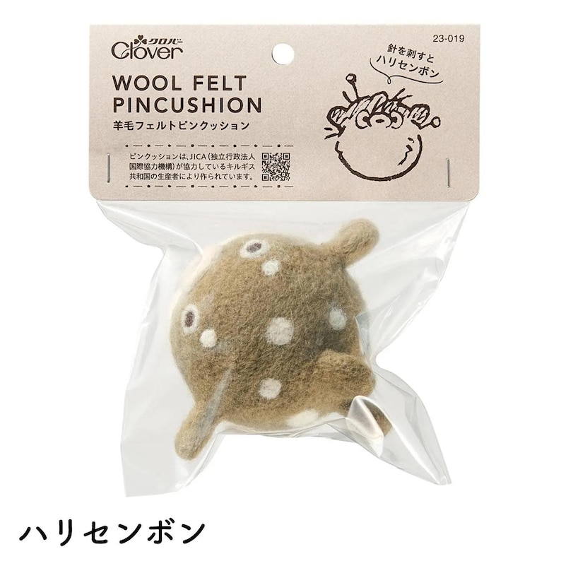May include: A wool felt pincushion in a clear plastic package. The pincushion is brown with white spots and shaped like a fish. The packaging includes Japanese text and the Clover logo.