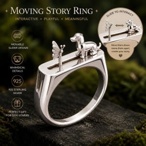 May include: A silver-colored ring featuring a movable slider design with a small dog and a butterfly on top. The ring includes text that reads Moving Story Ring, Interactive, Playful, Meaningful, Movable Slider Design, Whimsical Details, 925 Sterling Silver, Perfect Gift For Dog Lovers, Slide To Interact, and Move them closer, move them apart, create your story.