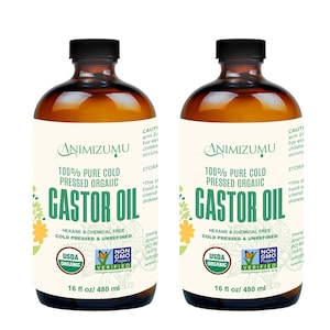 May include: Two amber-colored bottles of Animzumu castor oil. Each bottle has a black cap and a white label with green text that reads "100% Pure Cold Pressed Organic Castor Oil". The bottles are 16 fl oz / 480 ml.