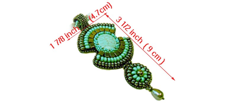 May include: A turquoise and silver beaded pendant with a white stone center. The pendant is 1 7/8 inches long and 3 1/2 inches wide.