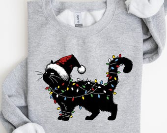 かわいい猫のクリスマスライトスウェットシャツ、プレッピーな黒猫のクリスマススウェットシャツ、心地よいクリスマスシャツ、家族向けのクリスマス、猫ママへのクリスマスプレゼント