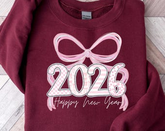 ハッピーニューイヤーコケット2026スウェットシャツ：ツリー＆ボウグラフィックTシャツ、ハロー2026パーカー、ハッピーニューイヤーシャツ、ニューイヤーシャツ、新年ギフト