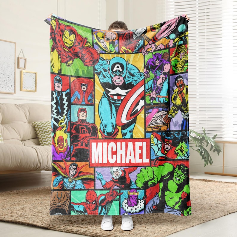 May include: A white ceramic mug with a black handle and the text "But First, Coffee" in a bold, black font. The mug is set against a blurred background, suggesting a cozy setting.