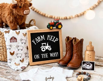May include: A charming farm-themed baby announcement featuring a plush Highland cow, a toy tractor, and a sign that reads "Farm Help On The Way!". Includes baby boots, a onesie, a pacifier, and a baby bottle. A baby blanket with farm animals is also present.