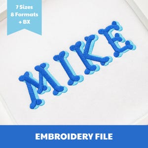May include: An embroidery file design featuring the name MIKE in a blue and light blue bone-shaped font. A light blue banner in the top left corner displays the text 7 Sizes 8 Formats + BX. The bottom blue banner contains the text EMBROIDERY FILE.