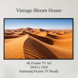 May include: A framed landscape print featuring a desert scene with sand dunes under a blue sky. The print is labeled "Vintage Bloom House" and "4K Frame TV Art". The resolution is 3840 x 2160.