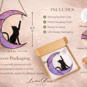 May include: A stained glass crescent moon suncatcher featuring a black cat silhouette reaching for a small star. The moon measures 16.5 cm by 16.5 cm. It includes a metal hanging chain, a suction cup, and a cardboard gift box for secure storage.