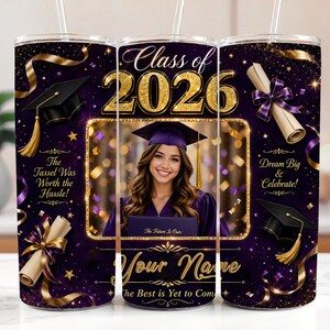May include: A purple and gold graduation tumbler with a photo of a graduate. The tumbler features the text "Class of 2026", "The Tassel Was Worth the Hassle!", and "Dream Big & Celebrate!" with a space for a name.
