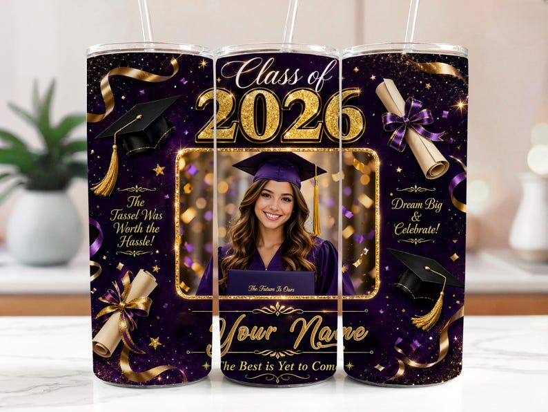 May include: A purple and gold graduation tumbler with a photo of a graduate. The tumbler features the text "Class of 2026", "The Tassel Was Worth the Hassle!", and "Dream Big & Celebrate!" with a space for a name.