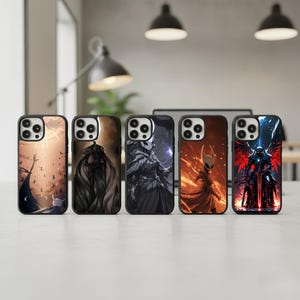 May include: Five black phone cases with unique fantasy art designs. The cases feature illustrations of characters in various poses, with color schemes ranging from warm oranges and reds to cool blues and grays. The cases are displayed on a white surface.
