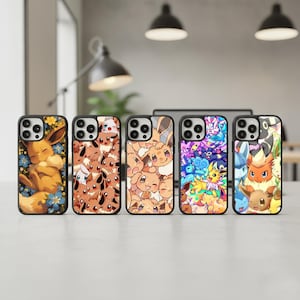 May include: Five black phone cases with colourful designs featuring various Pokémon characters. The cases showcase different characters and vibrant colour schemes, including yellow, brown, blue, and purple. The cases are displayed on a light-coloured surface.