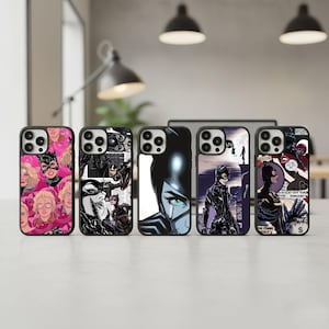 May include: Five black phone cases with Catwoman-themed designs. The cases feature various comic book illustrations of Catwoman in different poses and styles, with pink, black, and purple backgrounds.