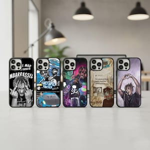 May include: Five black phone cases with various designs. One case features a black and white image with text. Another has a blue car graphic. A third case has a skull and crossbones design. The fourth case has a quote. The last case has a person making a heart with their hands.