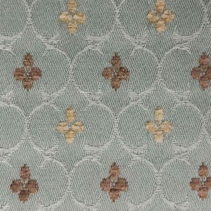 May include: A sage green fabric featuring a repeating woven pattern of interlocking circles. Within each circle, there is a small, embroidered floral motif alternating between light beige and muted brown colours, creating a textured surface.