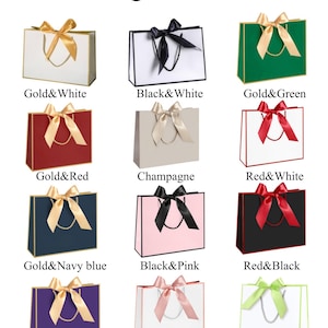 May include: An image showcasing various gift bags with different color combinations. The bags feature a ribbon bow and come in colors like gold and white, black and white, gold and green, gold and red, champagne, red and white, gold and navy blue, black and pink, red and black, gold and purple, pink and white, and green and white.