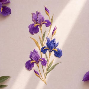 May include: An embroidered patch featuring three iris flowers in shades of purple and blue with yellow accents. The design includes green stems and leaves, along with two closed flower buds, all rendered with detailed thread work on a light surface.