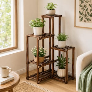May include: A multi-tiered dark brown wooden plant stand with a stepped design, featuring five slatted shelves at varying heights. The stand holds five potted plants in assorted ceramic and woven containers, arranged on the different levels.