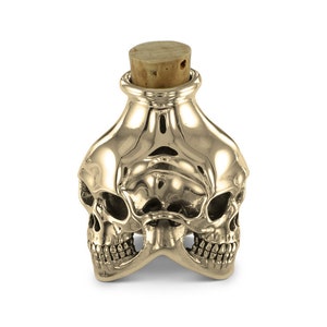 Schedelfles - bronzen fles met drie schedels