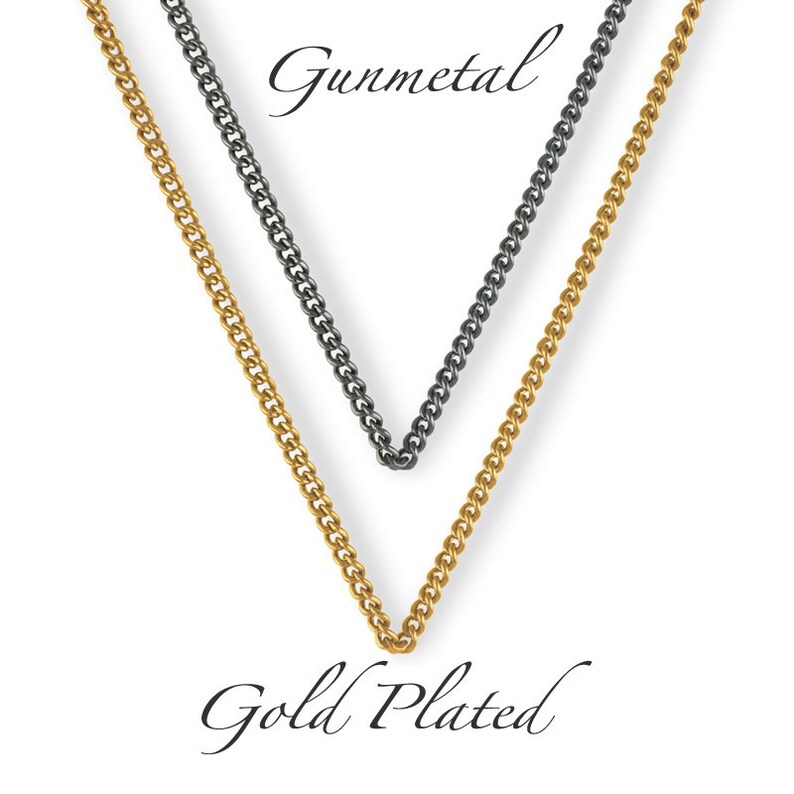 May include: Two chains, one gold plated and one gunmetal, are shown hanging against a white background. The chains are both curb chains.